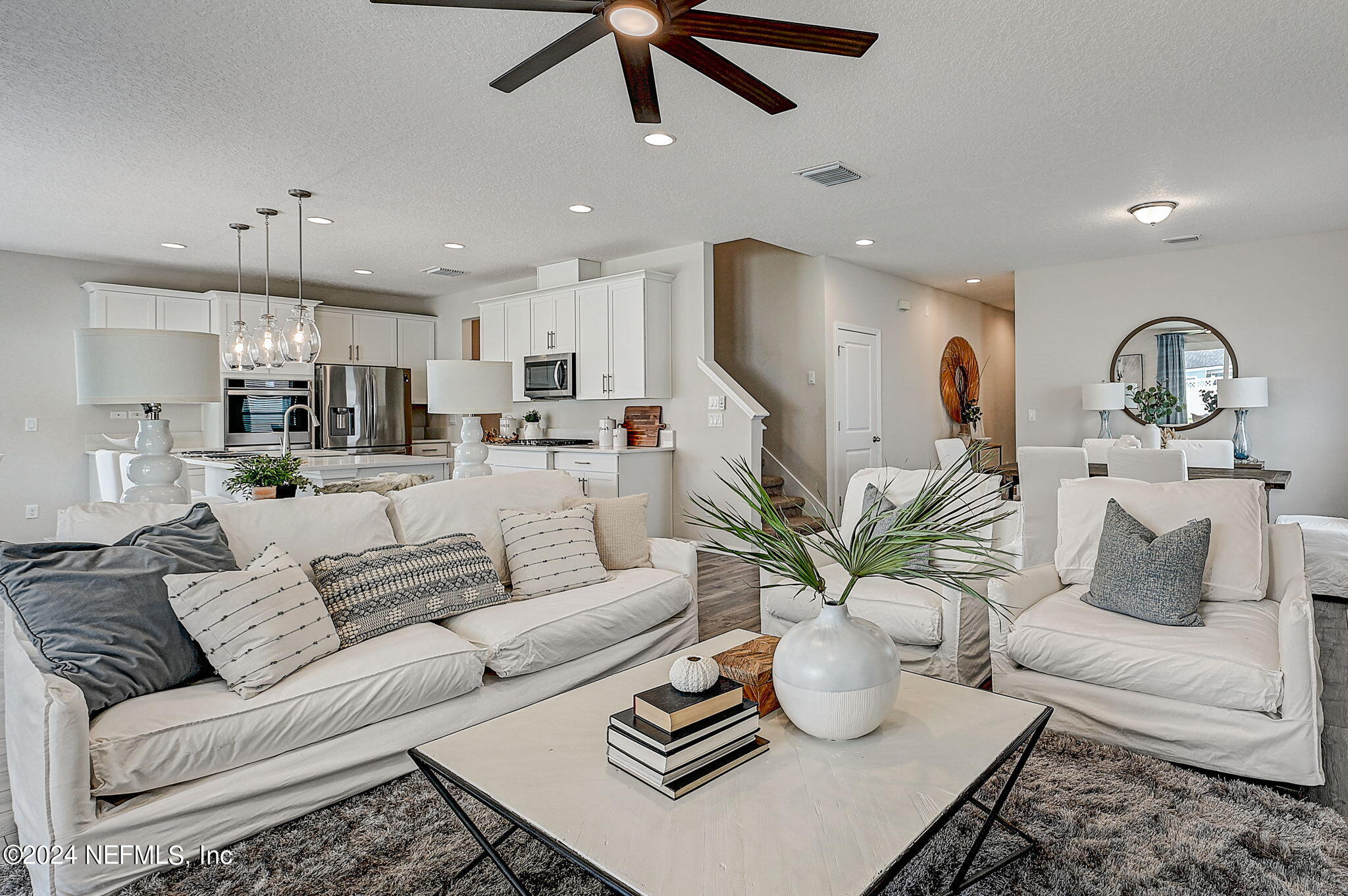 433 Watervale Drive St. Augustine, FL 32092 - Photo 4 of 66 a living room with furniture kitchen view and a potted plant
