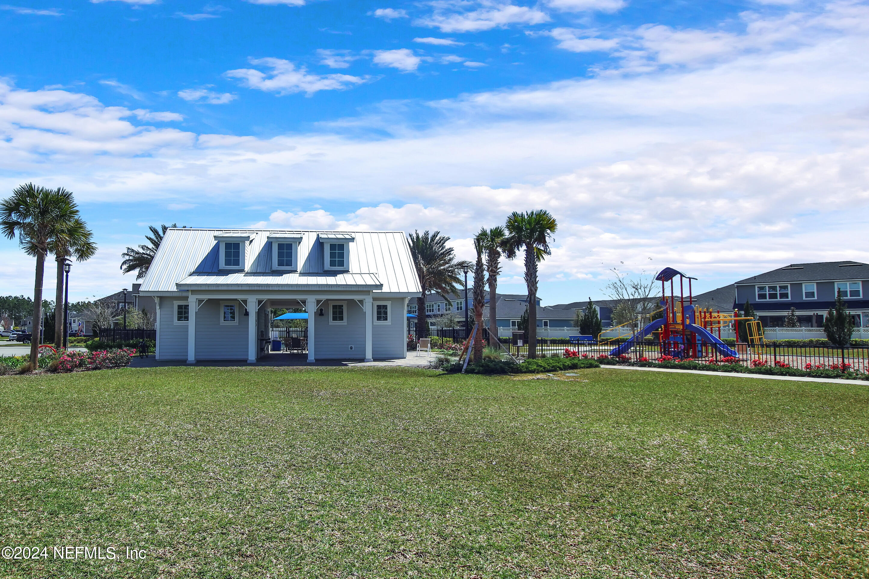 433 Watervale Drive St. Augustine, FL 32092 - Photo 56 of 66 a view of a house with a big yard and palm trees