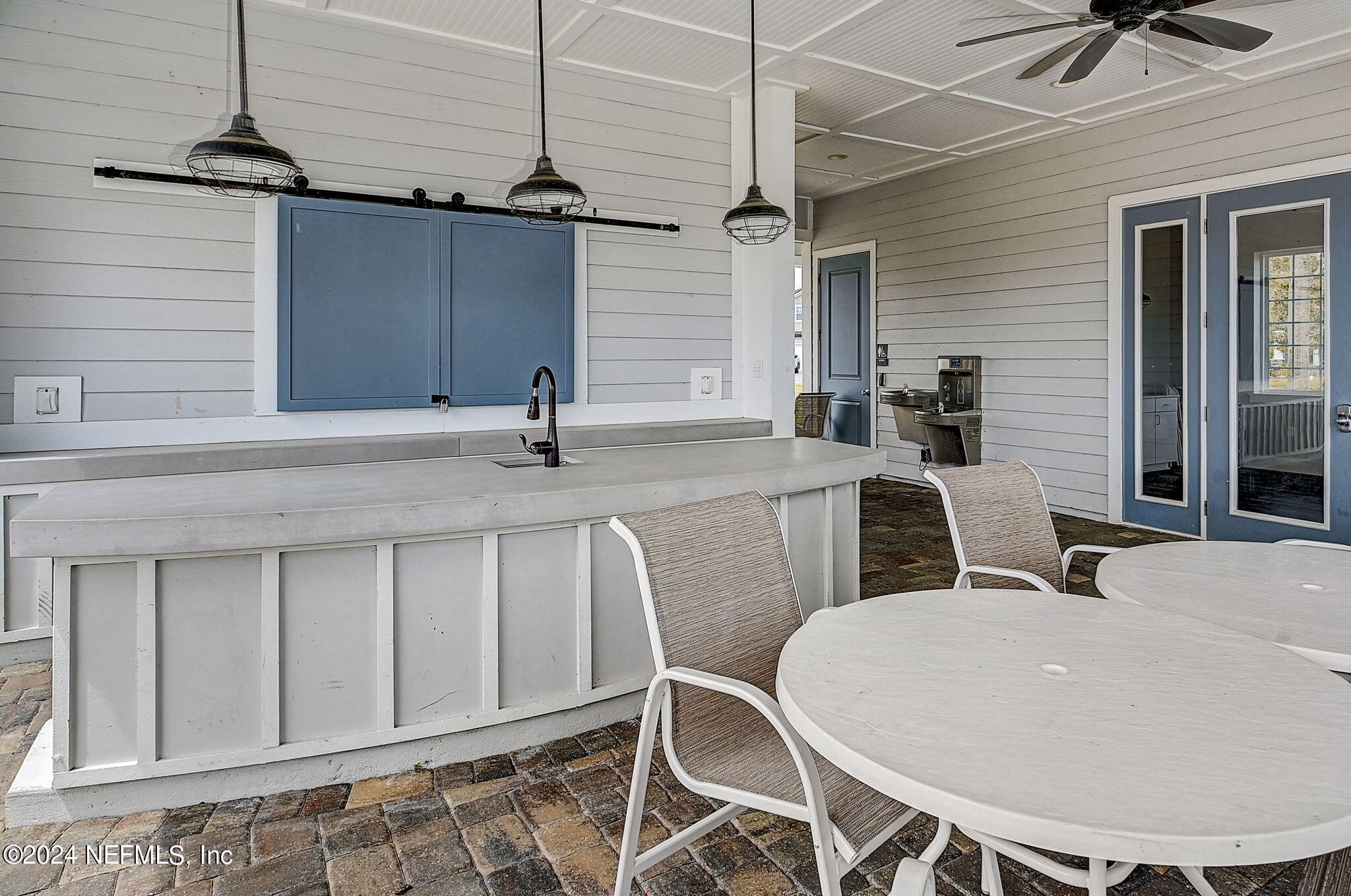 433 Watervale Drive St. Augustine, FL 32092 - Photo 64 of 66 a kitchen with a table chairs and a chandelier