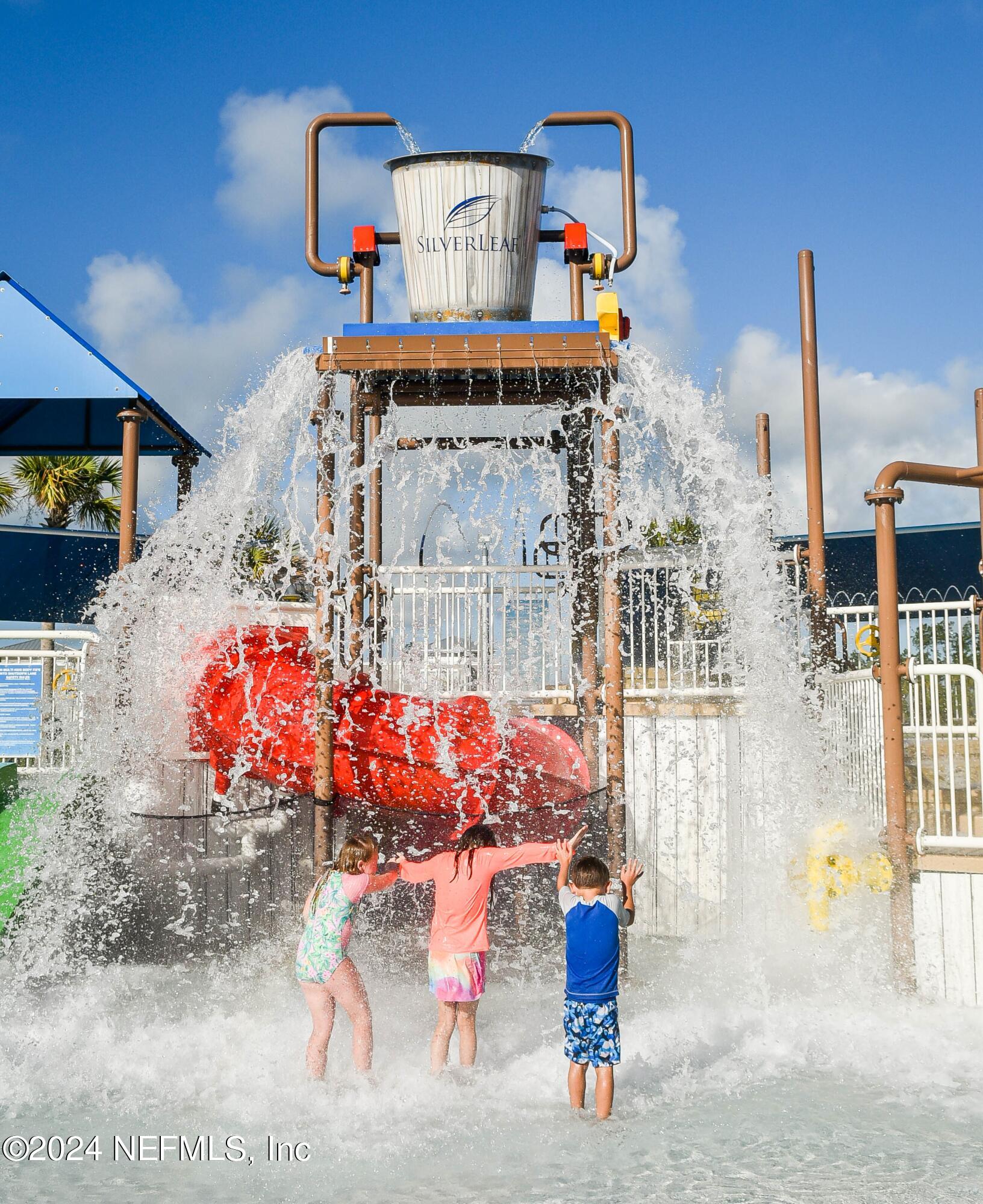 433 Watervale Drive St. Augustine, FL 32092 - Photo 65 of 66 a front view of a building with retail shops