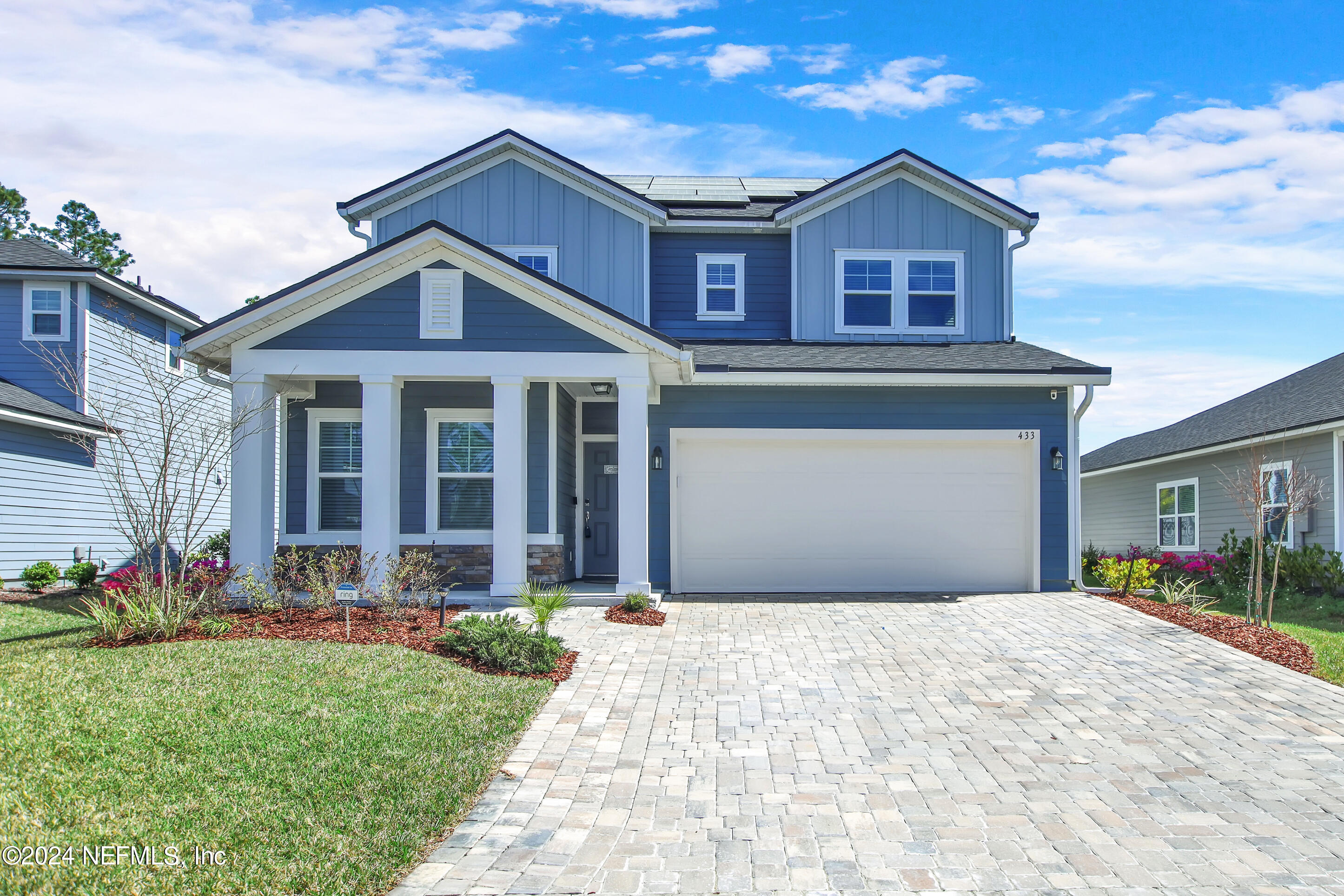 433 Watervale Drive St. Augustine, FL 32092 - Photo 7 of 66 a front view of a house with a yard and garden