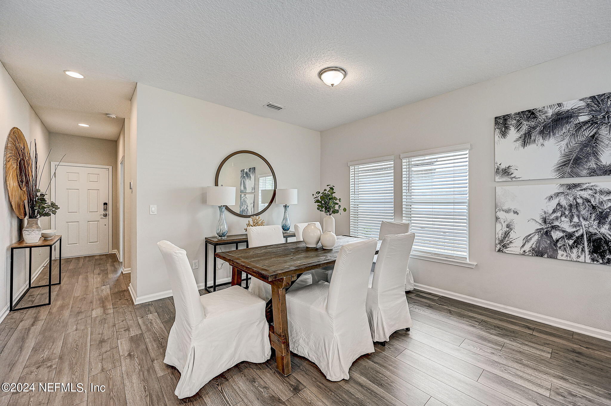 433 Watervale Drive St. Augustine, FL 32092 - Photo 10 of 66 a view of a dining room with furniture window and wooden floor