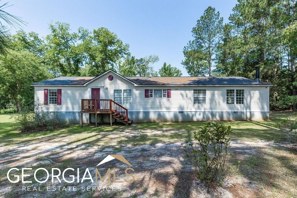 838 Foster Williams Road Register, GA 30452 - Photo 1 of 1 a view of a house with a yard