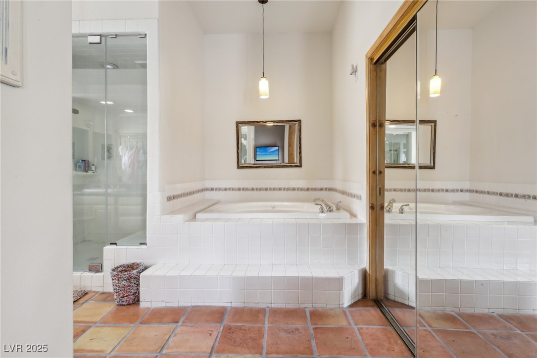 519 North Racetrack Road Henderson, NV 89015 - Photo 57 of 98 Bathroom featuring a stall shower and a garden tub