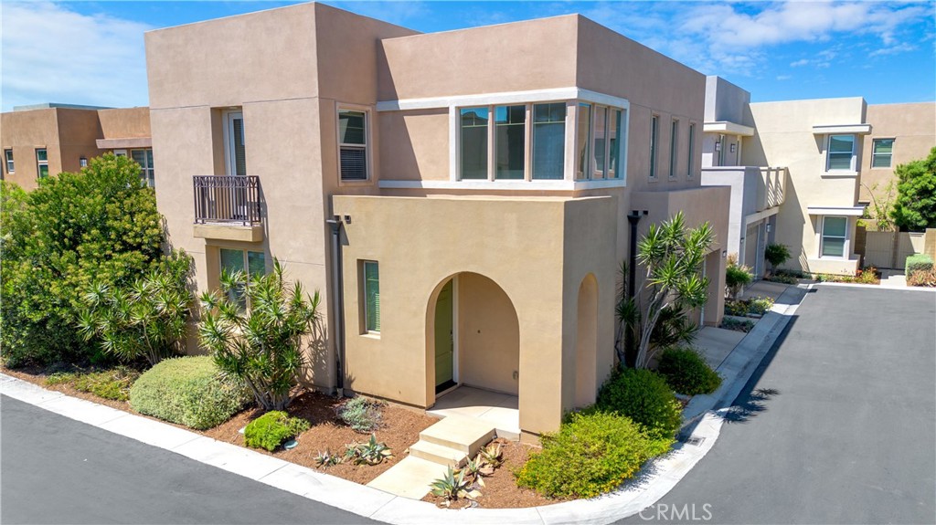 239 Radial Irvine, CA 92618 - Photo 1 of 1 a front view of a house with garden