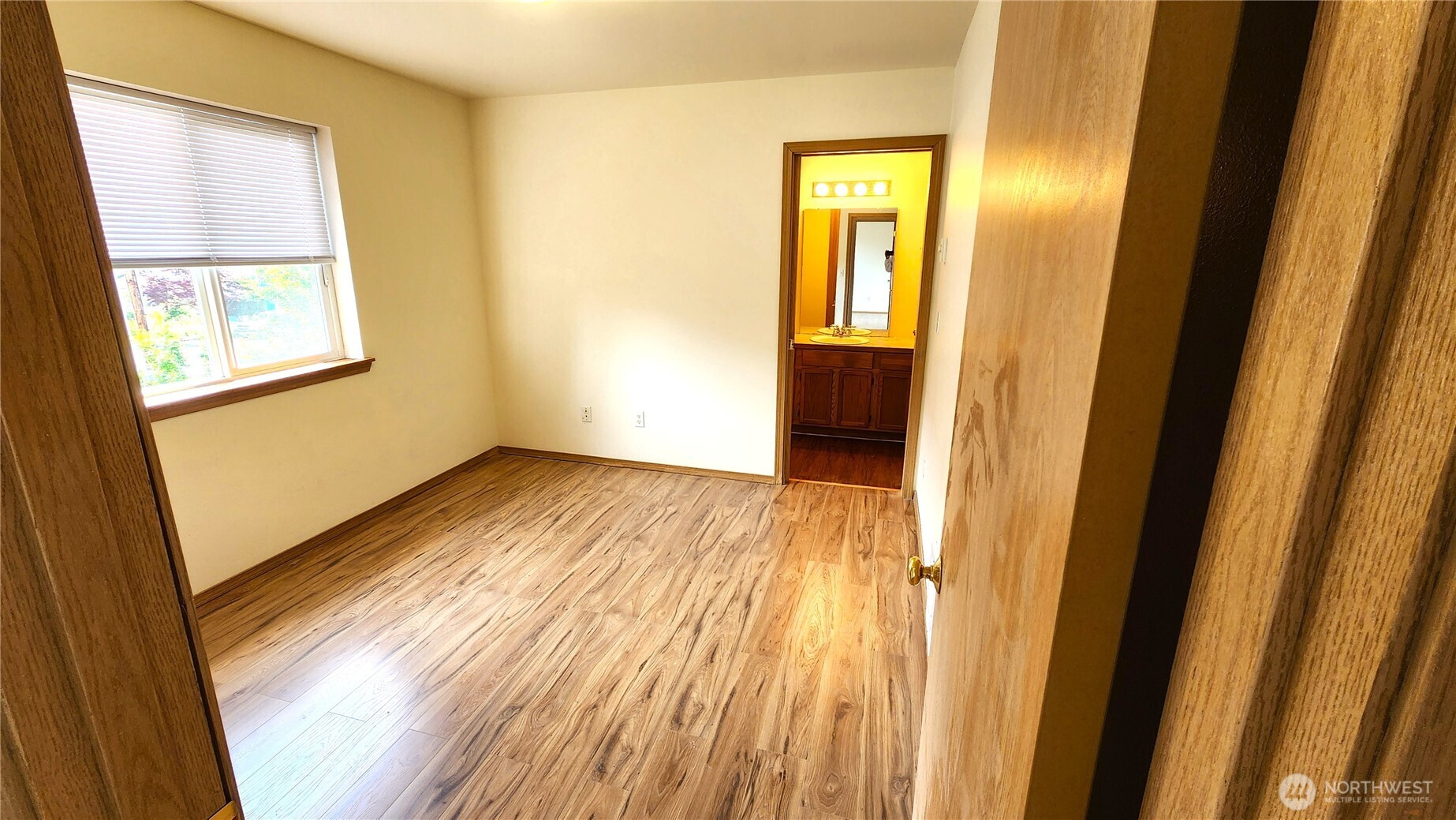 2316 Xenia Street, Unit 2316 Bellingham, WA 98229 - Photo 11 of 23 a view of an empty room with wooden floor and a window