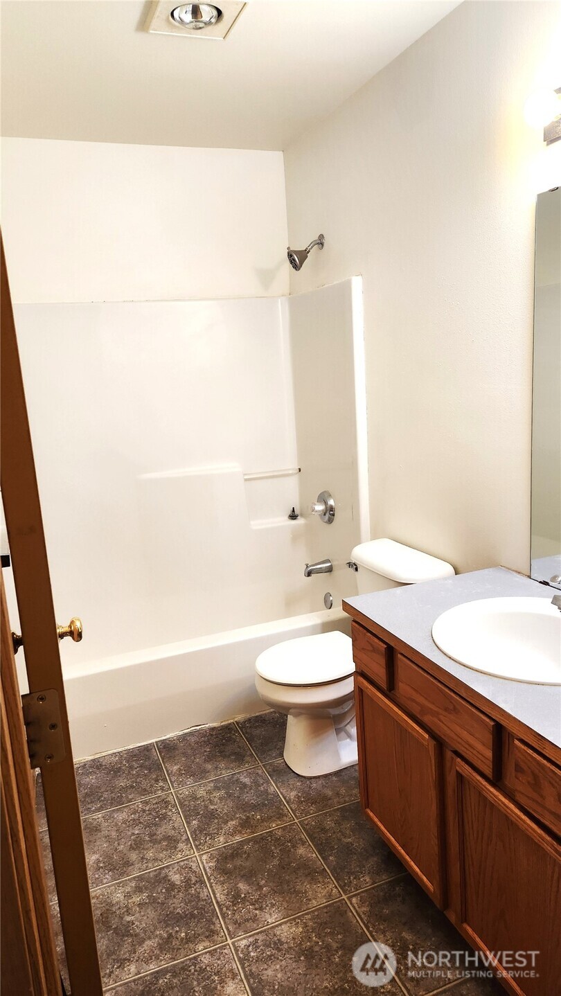 2316 Xenia Street, Unit 2316 Bellingham, WA 98229 - Photo 14 of 23 a bathroom with a toilet a sink and bathtub