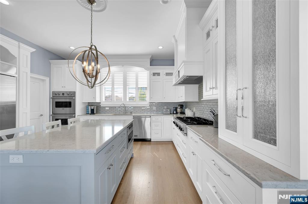 6 Capstan Road Waretown, NJ 08758 - Photo 13 of 47 a large white kitchen with a large window appliances and cabinets