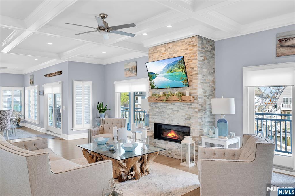 6 Capstan Road Waretown, NJ 08758 - Photo 19 of 47 a living room with furniture a fireplace and a flat screen tv