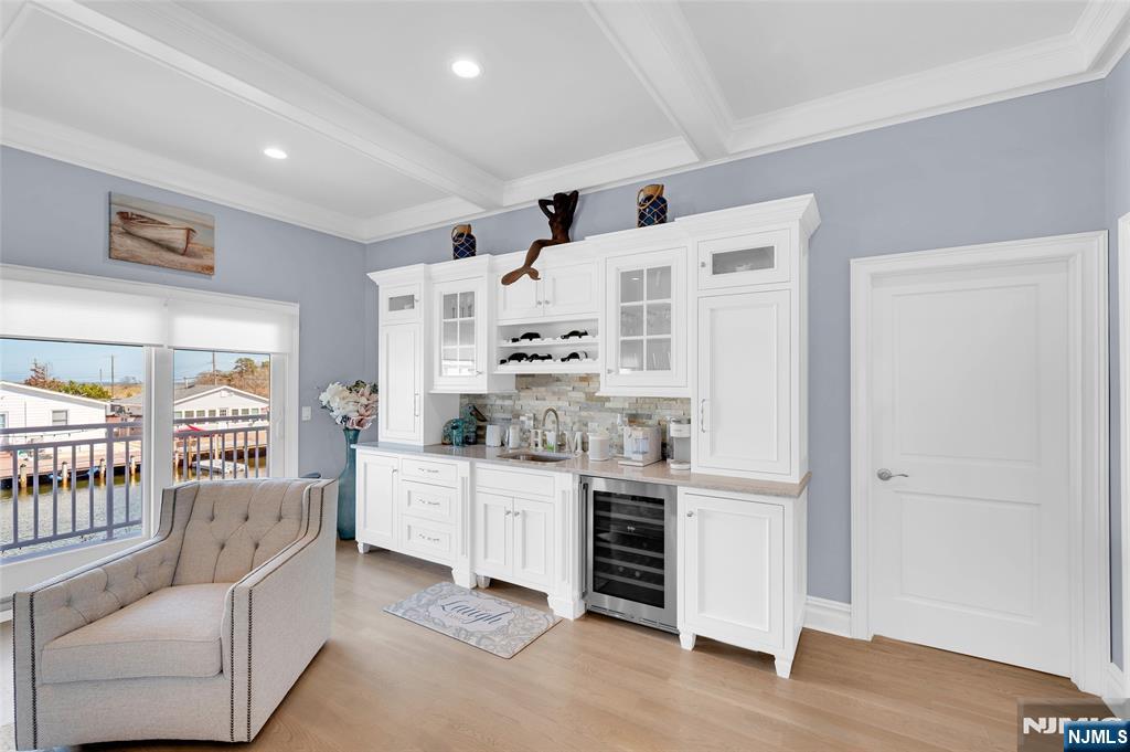 6 Capstan Road Waretown, NJ 08758 - Photo 20 of 47 a kitchen with white cabinets and wooden floor