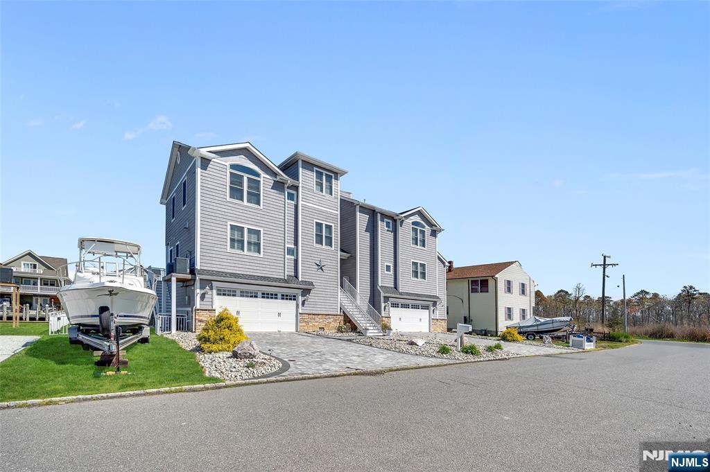 6 Capstan Road Waretown, NJ 08758 - Photo 2 of 47 a view of a street with a building in the background