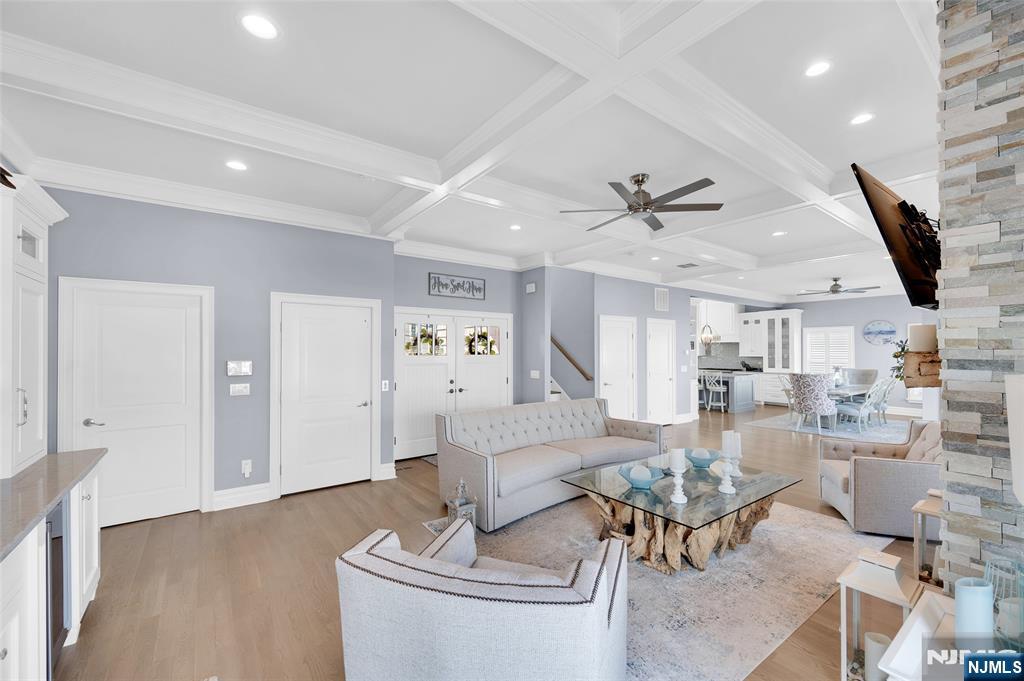6 Capstan Road Waretown, NJ 08758 - Photo 21 of 47 a living room with fireplace furniture and a wooden floor