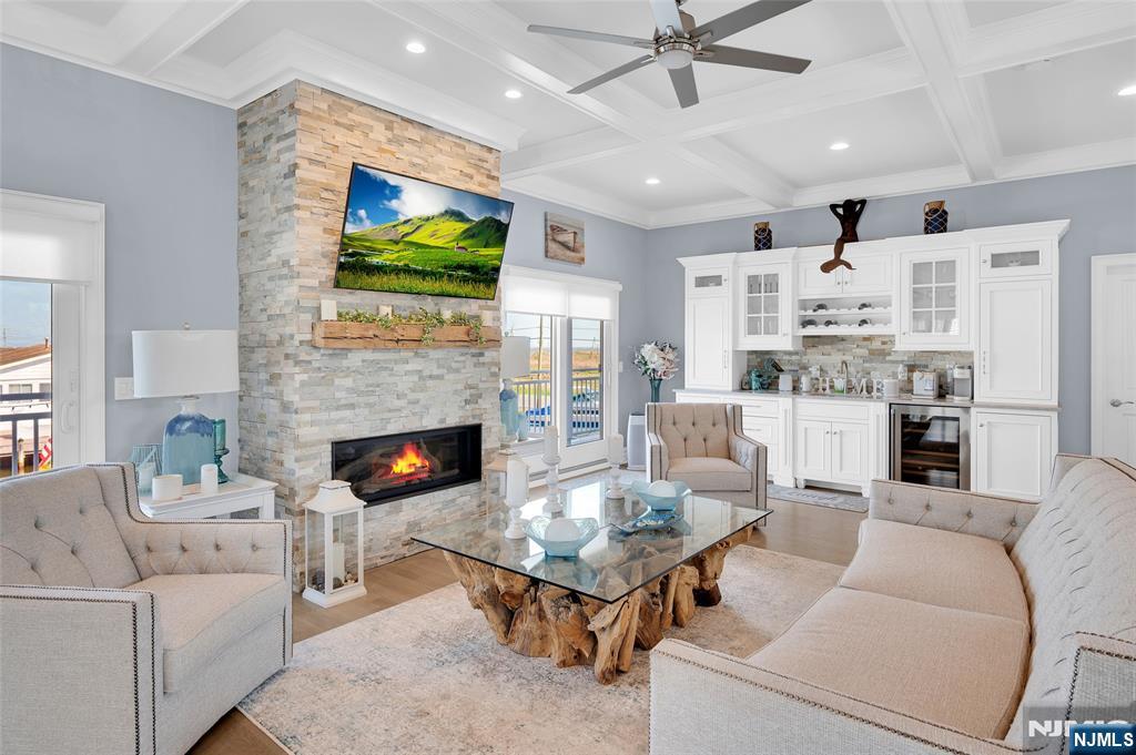6 Capstan Road Waretown, NJ 08758 - Photo 22 of 47 a living room with furniture fireplace and flat screen tv