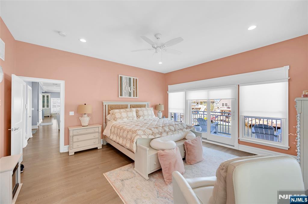 6 Capstan Road Waretown, NJ 08758 - Photo 26 of 47 a bedroom with furniture and large windows