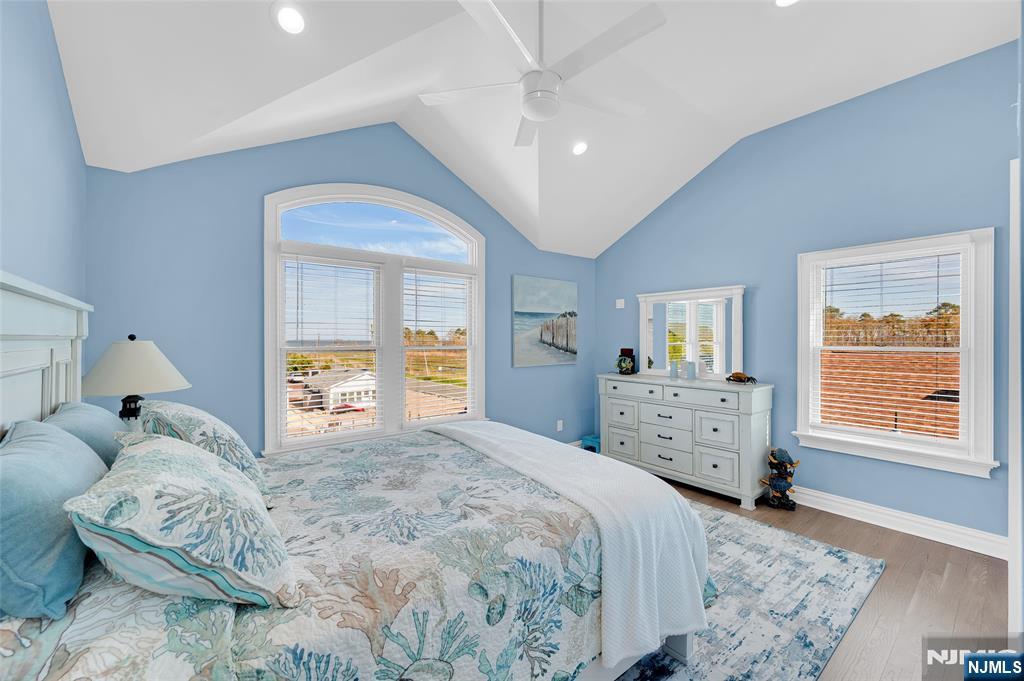 6 Capstan Road Waretown, NJ 08758 - Photo 31 of 47 a bedroom with a bed and a window