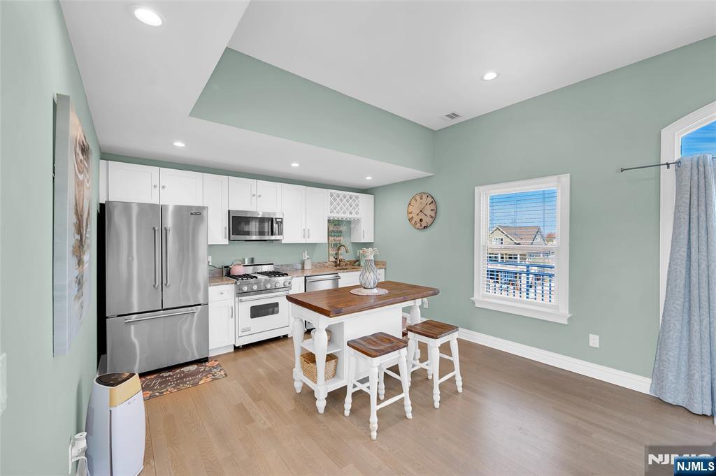 6 Capstan Road Waretown, NJ 08758 - Photo 36 of 47 a view of a dining room with furniture and a refrigerator