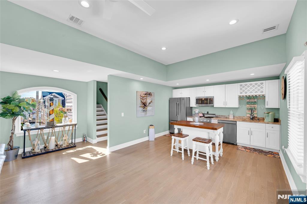 6 Capstan Road Waretown, NJ 08758 - Photo 37 of 47 a living room with furniture and a wooden floor