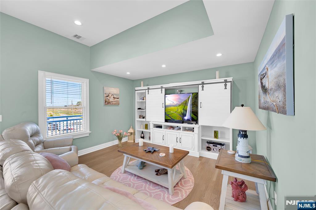 6 Capstan Road Waretown, NJ 08758 - Photo 39 of 47 a living room with furniture and a flat screen tv