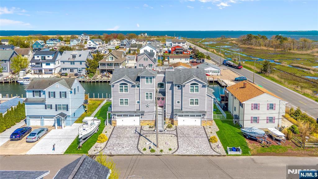 6 Capstan Road Waretown, NJ 08758 - Photo 7 of 47 an aerial view of residential houses with outdoor space and swimming pool