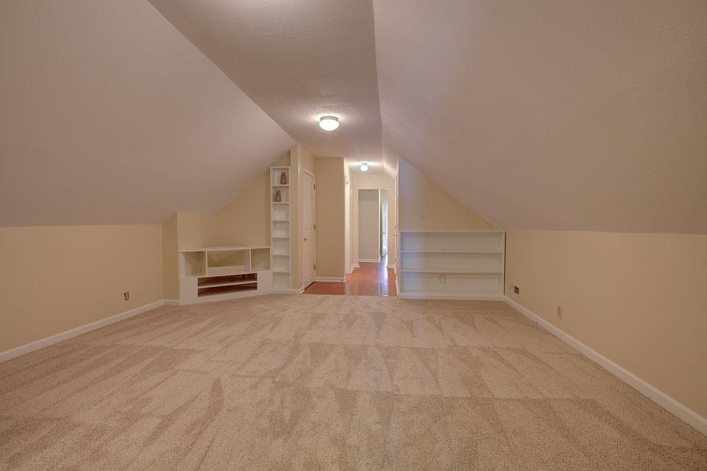 256 Pleasant Run Road Smyrna, TN 37167 - Photo 25 of 28 Another view of family room from fourth bedroom. Built-ins, new carpet, and paint.
