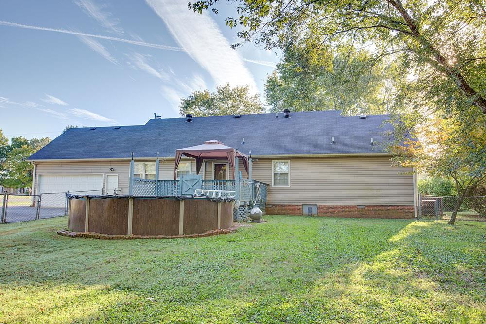 256 Pleasant Run Road Smyrna, TN 37167 - Photo 5 of 28 Deck, above ground pool, and fenced yard.