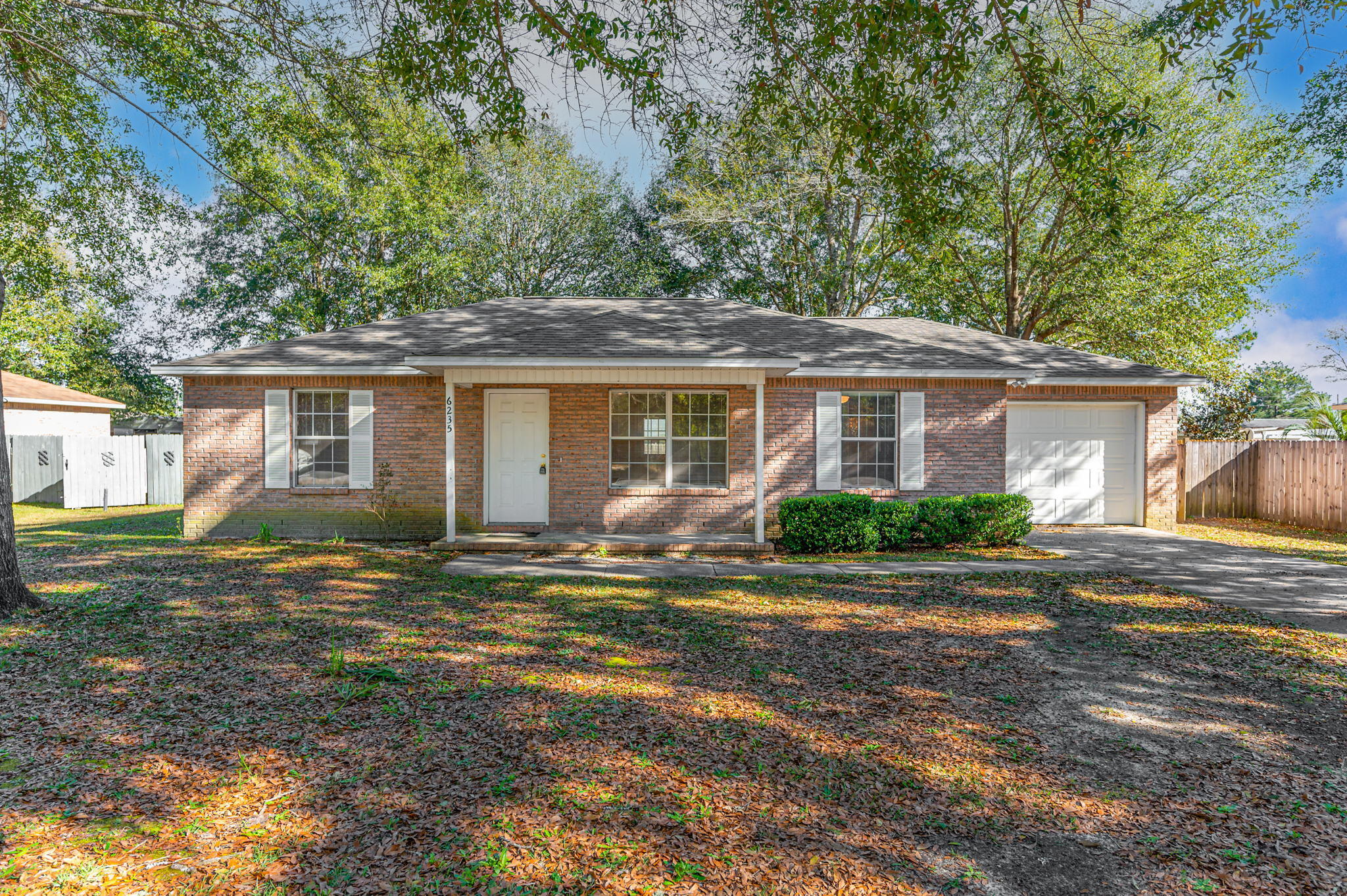 6235 Winstead Road Crestview, FL 32539 - Photo 1 of 31 front view of a house with a yard