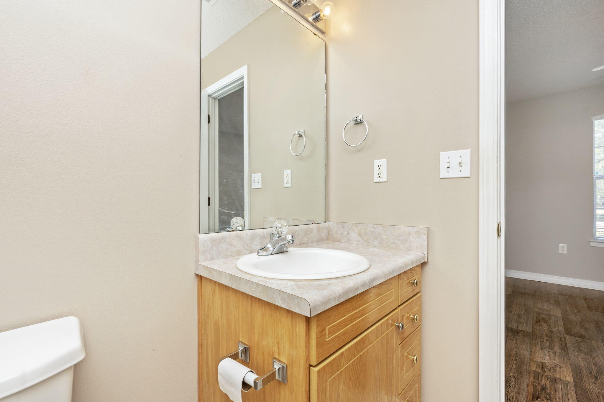 6235 Winstead Road Crestview, FL 32539 - Photo 17 of 31 a bathroom with a sink and a mirror