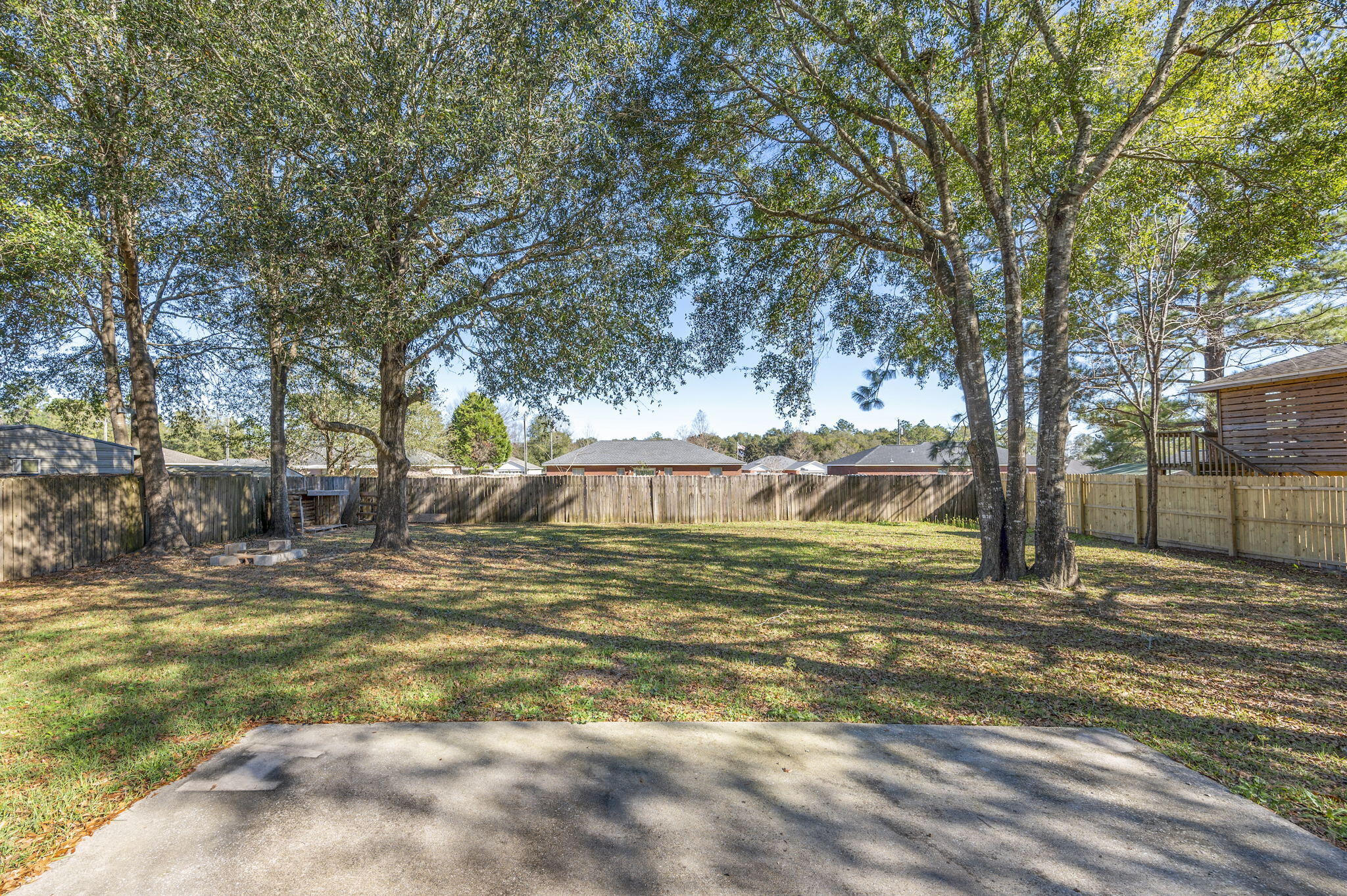 6235 Winstead Road Crestview, FL 32539 - Photo 26 of 31 a view of a yard with a house
