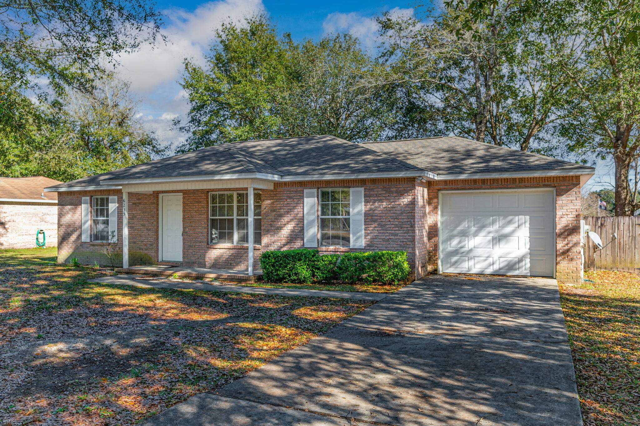 6235 Winstead Road Crestview, FL 32539 - Photo 3 of 31 a front view of a house with a yard and porch