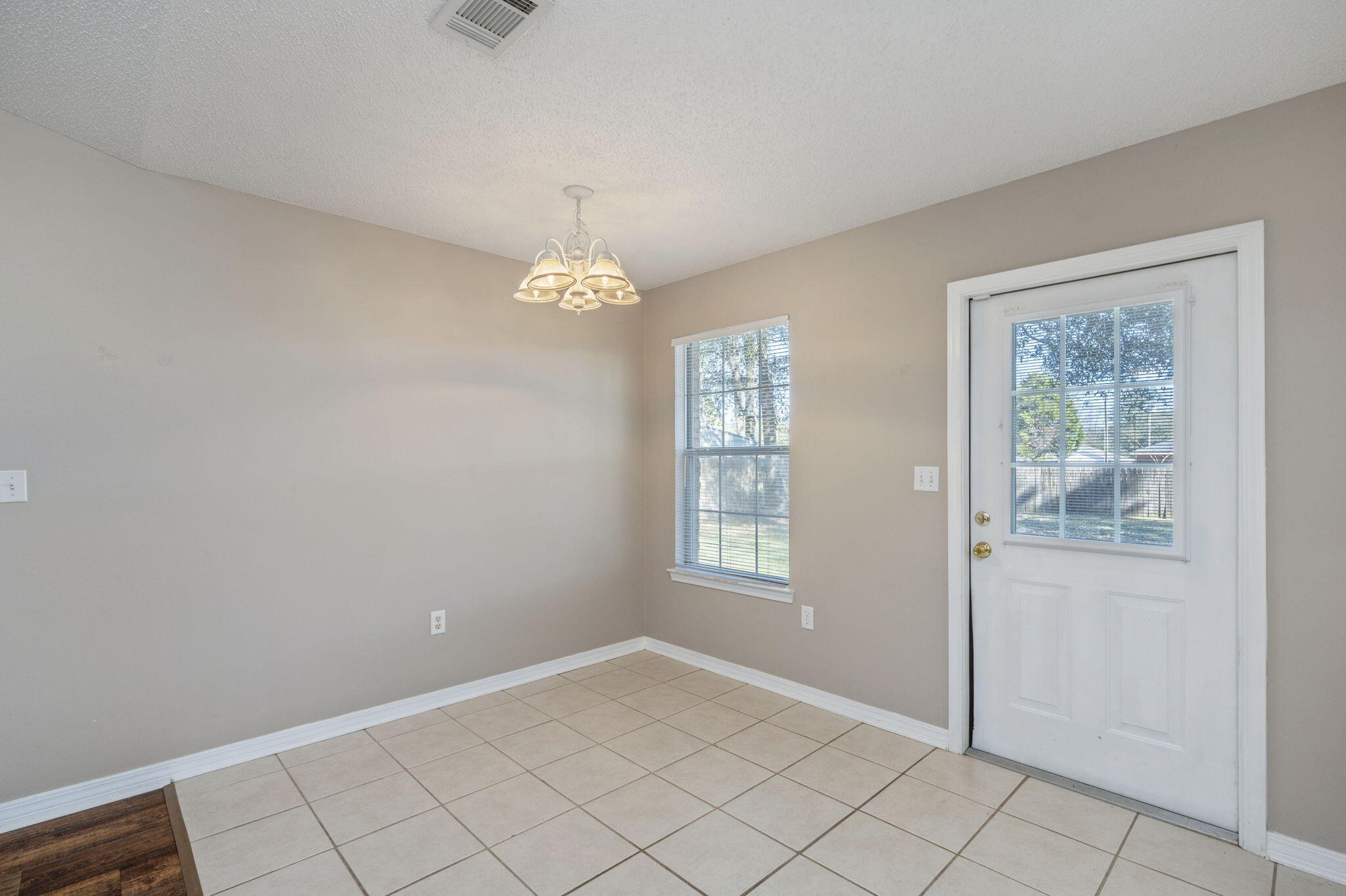 6235 Winstead Road Crestview, FL 32539 - Photo 7 of 31 a view of an empty room with window