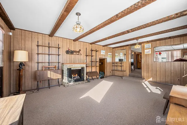 a view of a livingroom with furniture and a fireplace