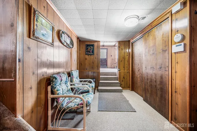 a view of a entryway with furniture and floor to ceiling window