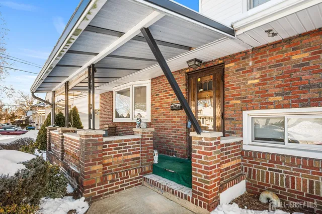 a brick building with a bench in front of it