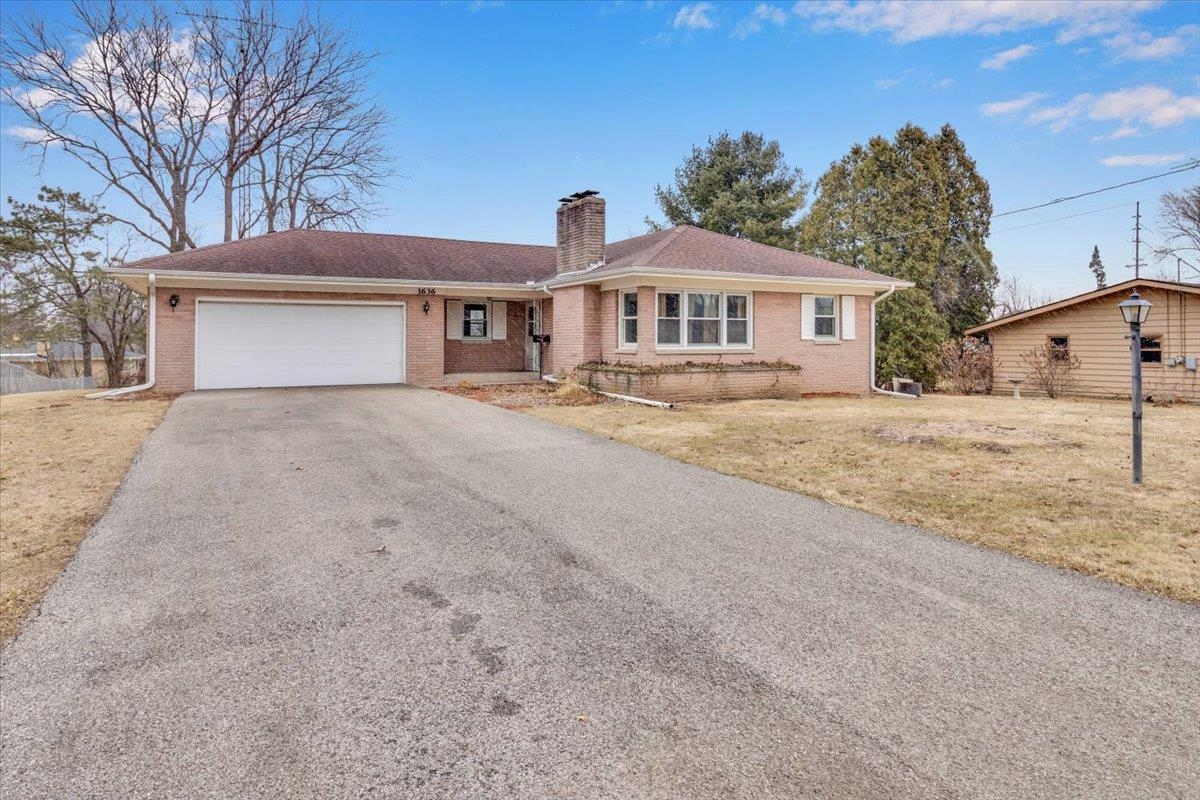 1636 Whitney Boulevard Belvidere, IL 61008 - Photo 2 of 36 a front view of a house with yard