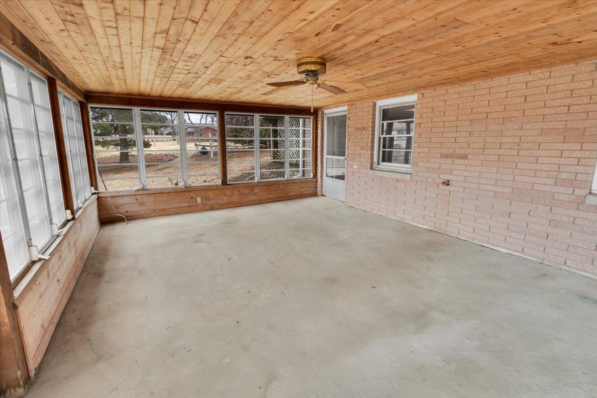 1636 Whitney Boulevard Belvidere, IL 61008 - Photo 29 of 36 a view of an empty room with a sliding door