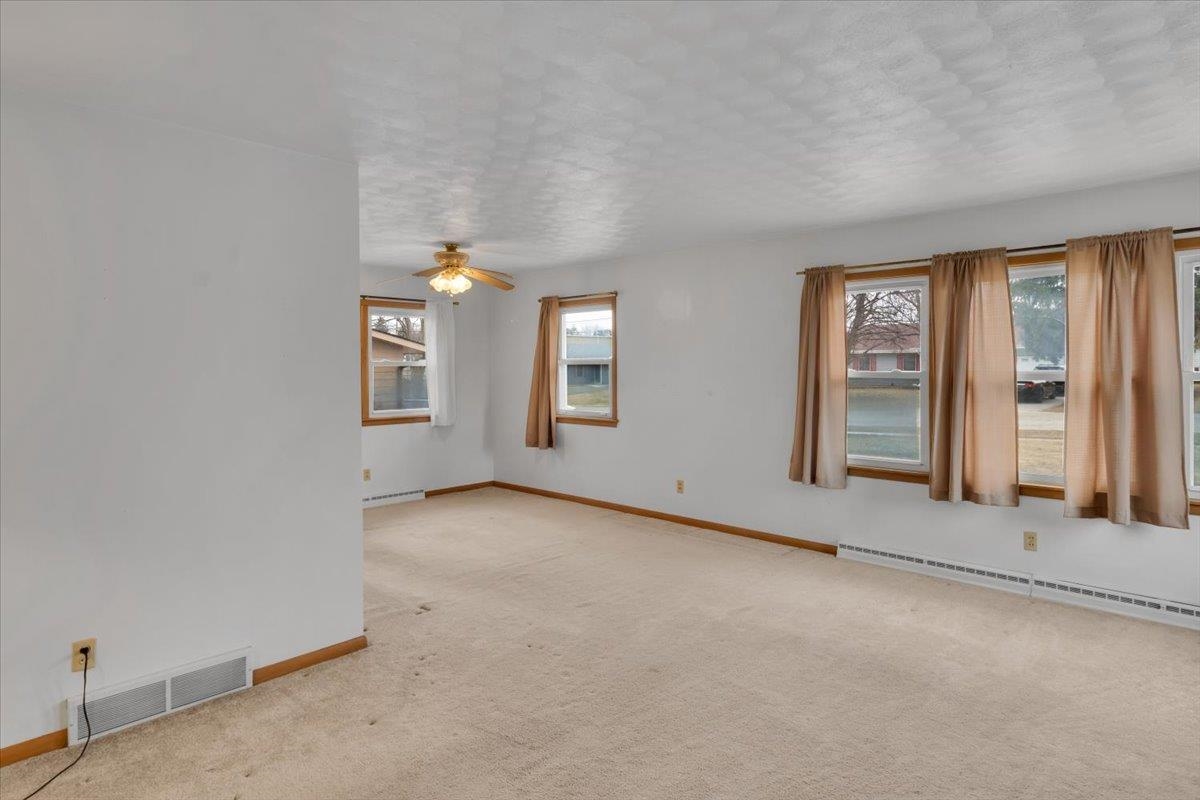 1636 Whitney Boulevard Belvidere, IL 61008 - Photo 8 of 36 an empty room with windows