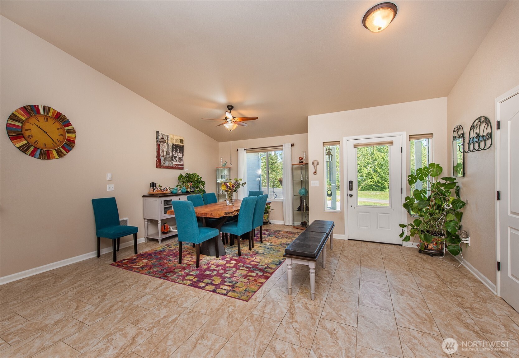 192 Michael Earl Way Sequim, WA 98382 - Photo 11 of 40 a view of a dining room with furniture and a potted plant