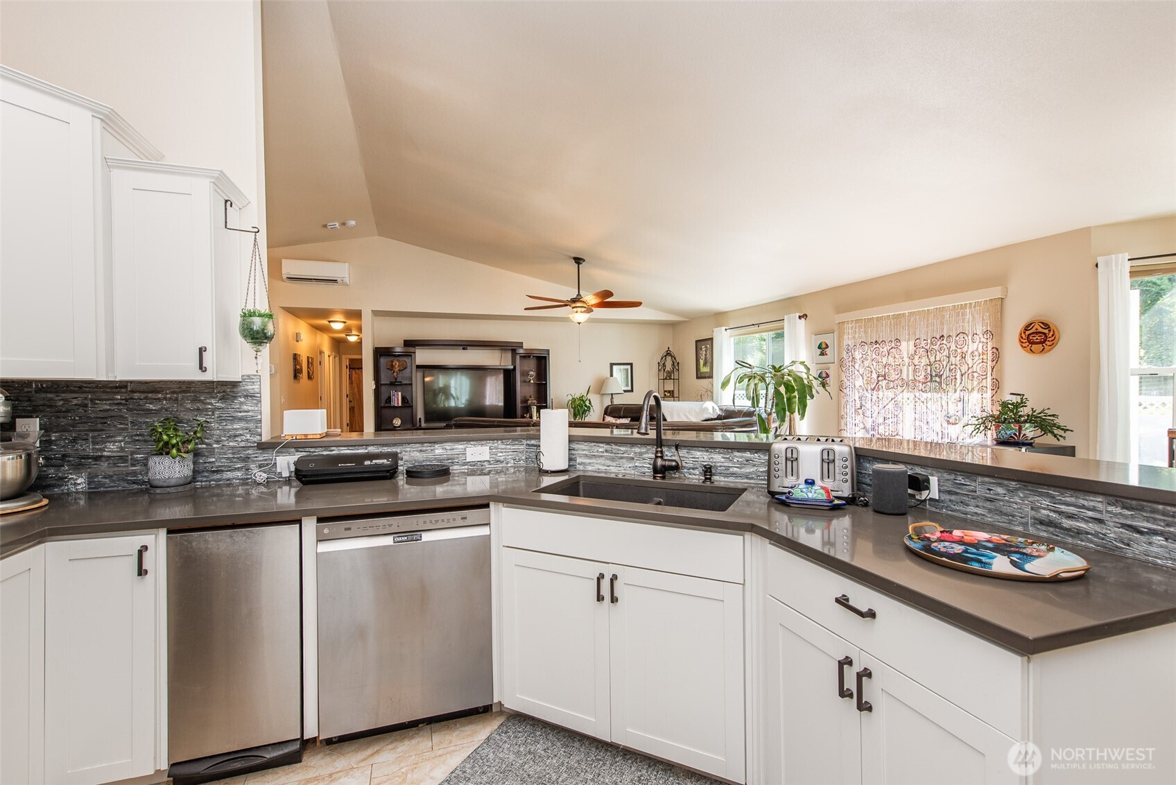 192 Michael Earl Way Sequim, WA 98382 - Photo 18 of 40 a kitchen with stainless steel appliances granite countertop a sink and cabinets