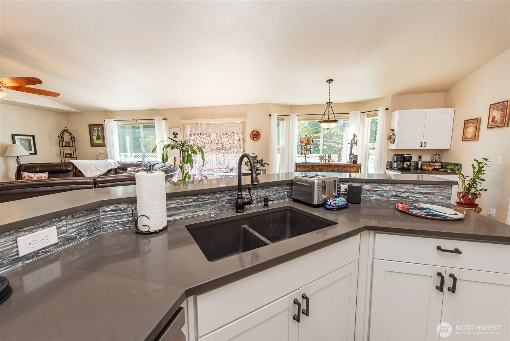 192 Michael Earl Way Sequim, WA 98382 - Photo 19 of 40 a kitchen with a sink stove and cabinets