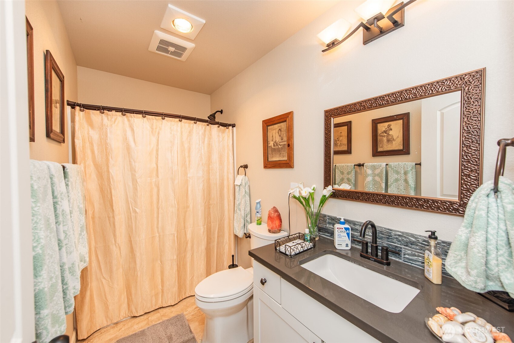 192 Michael Earl Way Sequim, WA 98382 - Photo 29 of 40 a bathroom with a granite countertop sink a toilet and a mirror