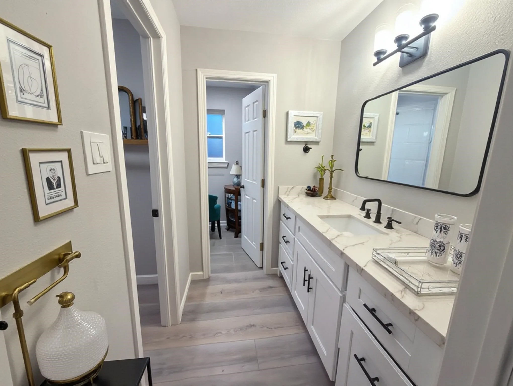 23918 Farm Hill Drive Spring, TX 77373 - Photo 13 of 16 a en suite bathroom with a double vanity sink and a mirror