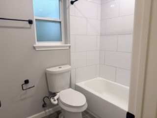 23918 Farm Hill Drive Spring, TX 77373 - Photo 15 of 16 a white toilet sitting next to a bath tub