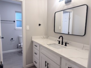 23918 Farm Hill Drive Spring, TX 77373 - Photo 16 of 16 a bathroom with a double vanity sink mirror and toilet