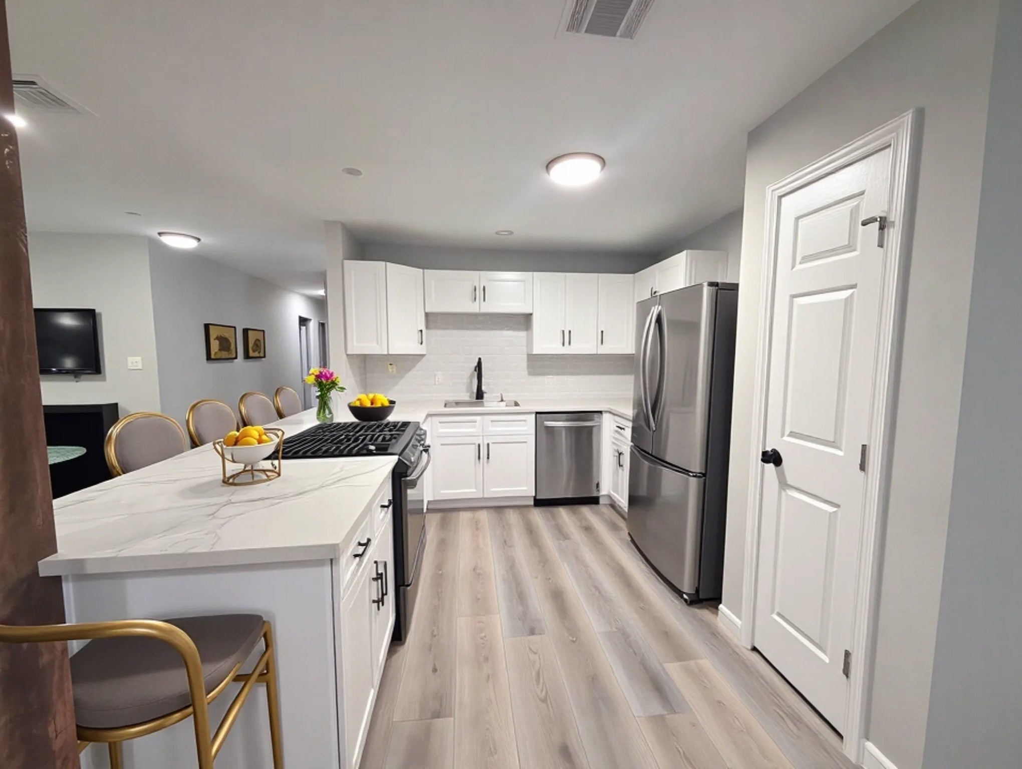 23918 Farm Hill Drive Spring, TX 77373 - Photo 7 of 16 a kitchen with a sink a refrigerator and white cabinets