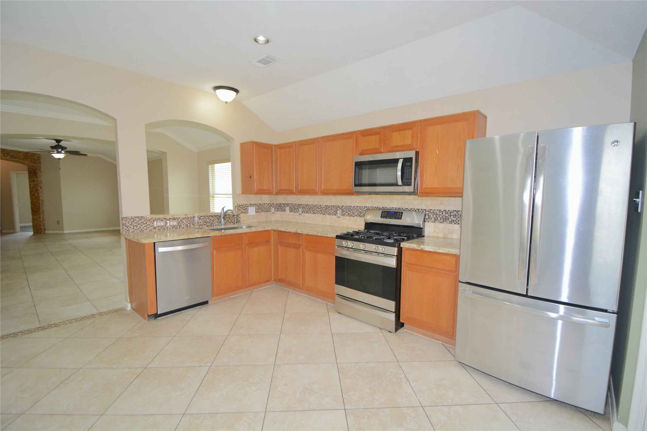 5135 Rustling Branch Lane Katy, TX 77449 - Photo 5 of 16 Kitchen opens to Dining area