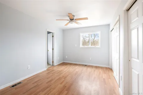 a view of a livingroom with wooden floor