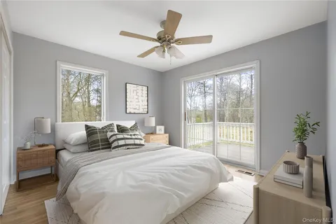 a bedroom with a large bed and a window