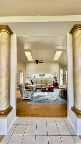 a dining room with furniture and wooden floor