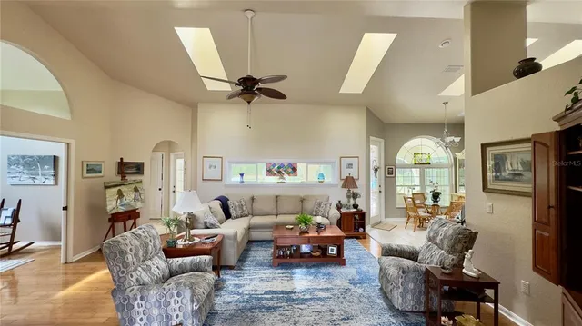 a kitchen with stainless steel appliances kitchen island granite countertop a refrigerator stove oven a sink and dishwasher