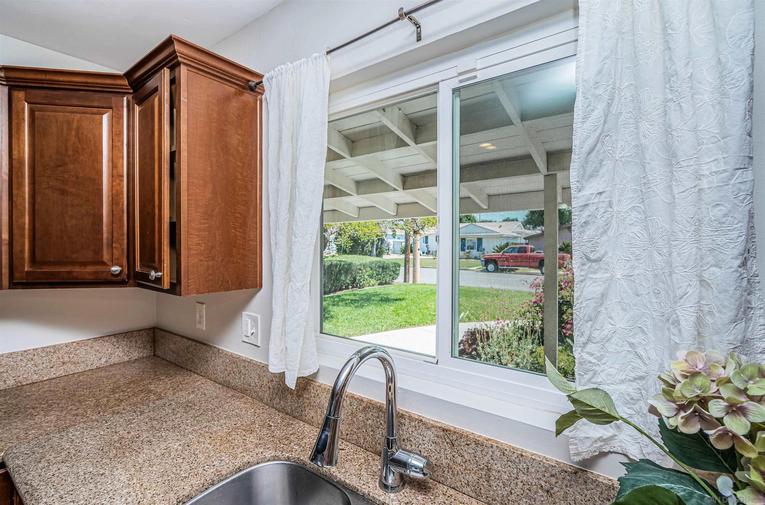 8410 Roy Street Lemon Grove, CA 91945 - Photo 15 of 40 a view of a room with a chair and a potted plant